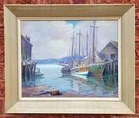 Full front view of framed painting against brick