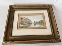 Full view of the framed watercolor painting showing a Venetian canal scene with gondola and buildings.