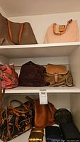 Shelves holding the 11 handbags and clutches, showing a mix of colors, patterns, and materials including leather and beaded clutches.