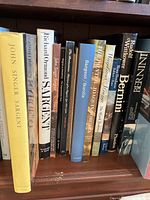 Shelf view showing spines of art books on John Singer Sargent through Bernini