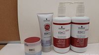 Four BC Bonacure hair therapy products including shampoo, conditioner, balm and cream.