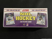 Front side of the sealed hockey card box with player images and brand info