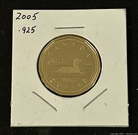 Front side of the 2005 silver proof loonie coin showing the loon design and inscriptions