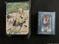 Photo of 1991 Ultimate Sports Cards Future Sensations Factory Set and Super Mario Lemieux Metallic Impressions Collector's Tin side by side.