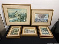 Five framed oil paintings laid out showing variety of landscape scenes and sizes from 8x10 to 16x19 inches.