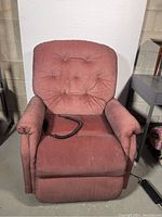 Front view showing overall upholstery and remote control on seat