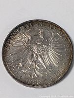 Front side view of the silver 1866 German Thaler coin showing the double-headed eagle detail and inscriptions.