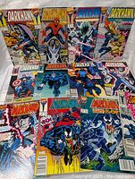 Front view of 14 Darkhawk Marvel Comic books with various colorful covers featuring characters like Spider-Man and Venom
