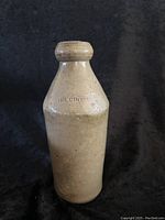 Full view of the Dr Cronks stoneware bottle with visible glaze and shape