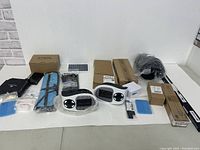 Overview of all items showing various boxed and bagged electrical and solar components.