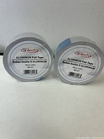 Two rolls of Xantech Aluminum Foil Tape side by side showing front labels with product specifications.