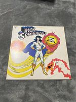 Front cover of the Rick Springfield comic book heroes vinyl LP album showing superhero illustration.