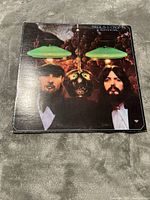 Front cover of Seals and Croft Diamond Girl LP showing two band members, green lamps, and intricate background.