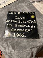 Front cover of 'The Beatles Live! at the Star-Club in Hamburg, Germany; 1962' album showing text and 2 LPs sticker.