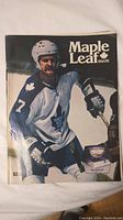 Front cover of 1977 Maple Leaf Magazine featuring a Toronto Maple Leafs hockey player in full uniform, wearing number 7.