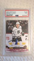 Front of 2022 Upper Deck Brandt Clarke Young Guns hockey card showing player in white LA Kings uniform, graded PSA 9 Mint.