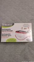 Box of Homedics Rechargeable Sports Massager showing product image and branding.