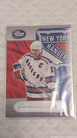 Front side of the Mark Messier hockey card showing him playing for New York Rangers with Calder branding.