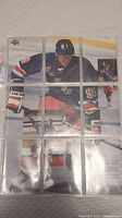 Front side of the 9-card puzzle showing Wayne Gretzky in New York Rangers uniform, assembled in nine card slots within a binder page.