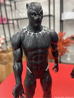 Front view of Black Panther figurine showing detailed outfit and necklace