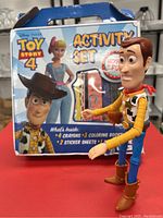 Front view of the Toy Story 4 activity set box with Woody figurine in front