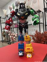 Front view of the full Voltron figurine showing its color scheme and form.
