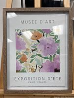 Front photo of the framed floral wall art print with French text and colorful flowers