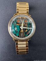 Front view of watch displaying transparent dial, silver hour markers, and visible Accutron movement