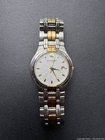 Front view of the vintage Wittnauer men's watch showing the dial and two-tone metal band.