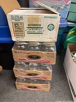 Four cases of mason jars stacked, one open showing 12x 250ml Bernardin jars in box