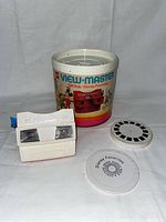 View-Master viewer, original cylindrical box with colorful vintage Disney character artwork, and two stereo reels including Disney Favorites reel