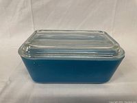Rectangular blue Pyrex refrigerator dish with clear glass lid