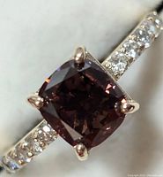 Top view close-up of the cushion cut brown lab-grown diamond and pavé set shank