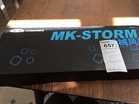 Original Mahegee MK-Storm keyboard box with product branding and MaxSold lot sticker