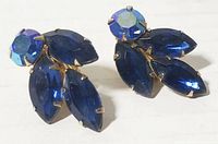 Front view of the pair of blue rhinestone clip-on earrings showing the round and marquise rhinestones.