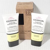 Two tubes of COVERGIRL TruBlend Base Business Skin Primer with a packaging box behind, showing front view of tubes.