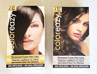 Two boxes of Color Eazy hair color, one dark brown (#2) and one medium brown (#3), front-facing showing packaging with models and product details