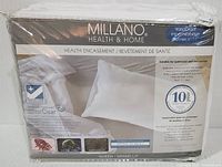 Packaged new Millano Health & Home queen size terry mattress encasement showing brand and waterproof breathable feature with SilverClear technology.