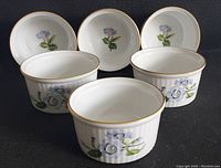 Front and side view of three Spode ramekins showing blue floral Stafford Flowers pattern and gold rim, displaying size and design details.