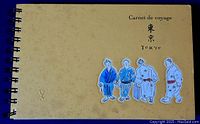 Full front cover of the Louis Vuitton Carnet de Voyage Tokyo travel book showing title, embossed LV logo, and illustrations of Japanese figures