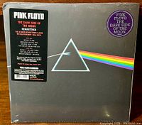 Front of vinyl record packaging with original hype sticker showing album details and iconic prism artwork.