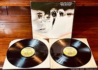 Photo showing both vinyl LPs with yellow London Records labels and gatefold album cover with band artwork.