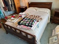 Overall view of assembled bed with bedding and accessories (not included)