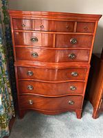Front view of dresser showing six drawers and metal oval ring pulls