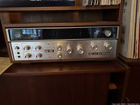 Full front view of receiver in wood cabinet