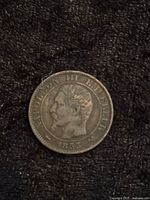 Obverse view of French coin showing profile of Napoleon III dated 1853.