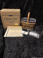 Photo showing original box, miniature basket with liners, Certificate of Authenticity, and literature.