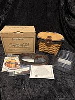 Complete set including the Small Saddlebrook Basket, original box, leather strap, plastic liner, and accompanying literature.