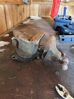 Photo of vintage Rock Island bench vise model 448 showing cast iron swivel base and vise jaws with screw tightening handle.