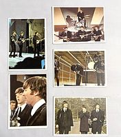 Fronts of five 1964 Beatles Color Cards showing the band in various poses and performance settings.